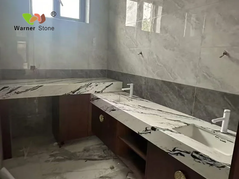 a bathroom with quartz counter tops and a sink